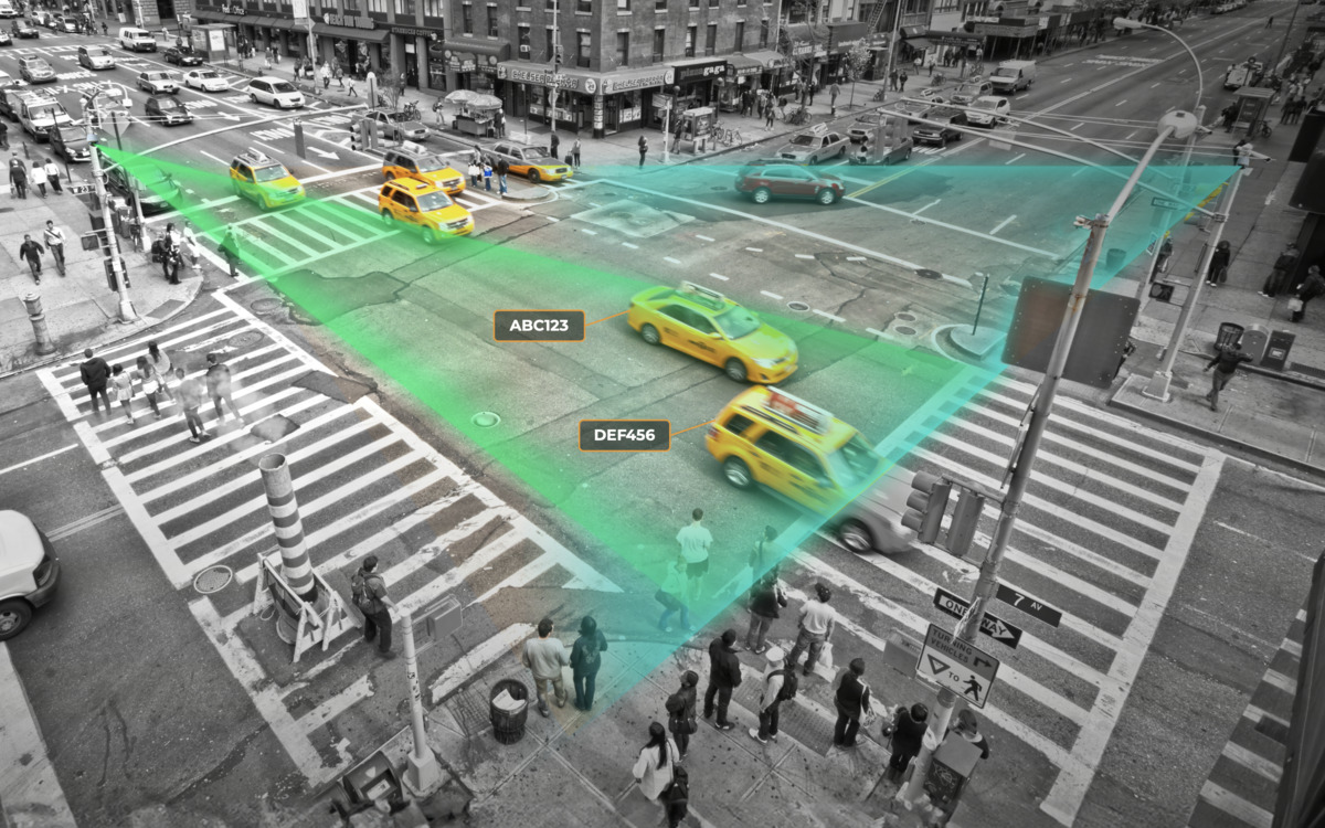 Graphics overlaid on an image of a busy intersection to demonstrate how PlateSmart Vision combines Video with LPR