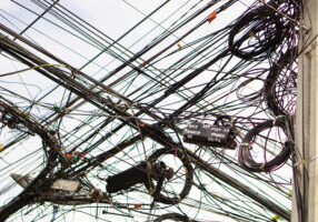 Jumble of wires showing badly done network connectivity