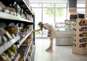 A photo of a lady shopping for products inside a retail store, used in a case study about fighting organized retail crime with the help of PlateSmart ALPR